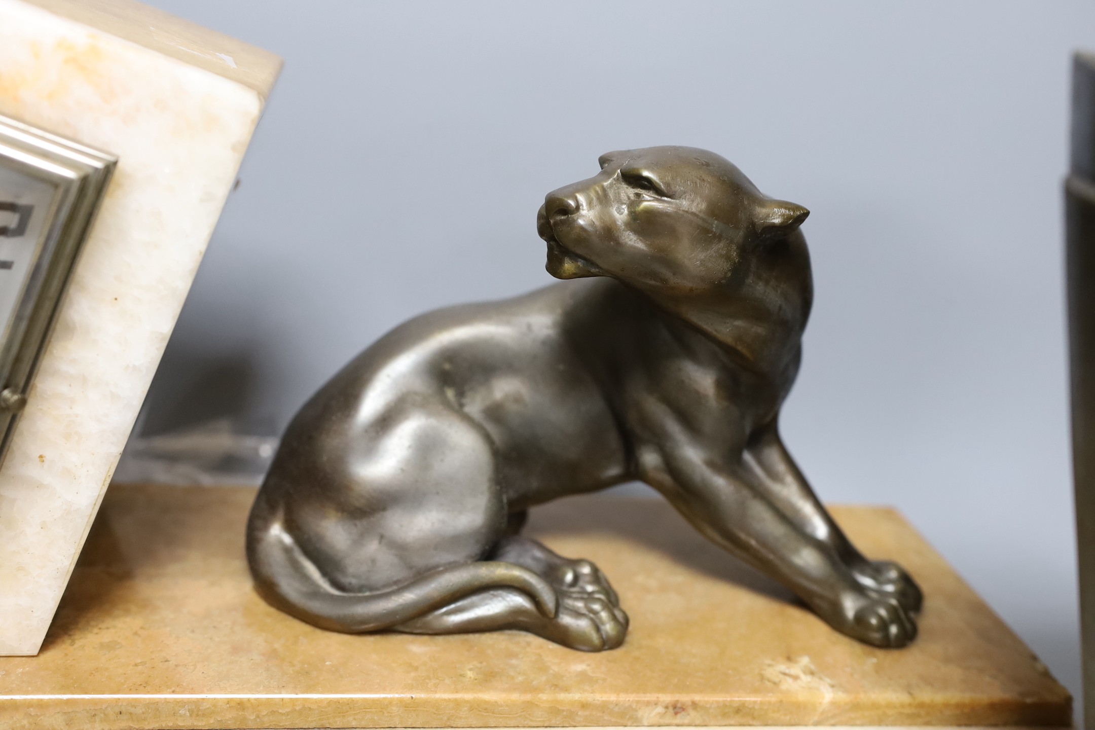 An Art Deco marble and spelter panther clock garniture